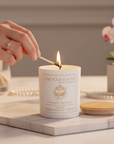 Immaculate heart of Mary scented prayer being lit by a female hand on an elegant background