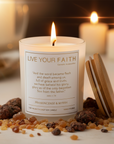 Candle with Bible verse John 1:14 surrounded by frankincense and myrrh on a blurred background