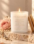 Ave Maria Rose Petals Catholic prayer candle with pearl rosary on warm stone.