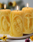 Set of three beeswax candles with images of the Holy Family, Virgin Mary and Jesus on the Cross