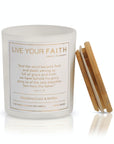 Candle with 'Live Your Faith' text and wooden lid on a white background