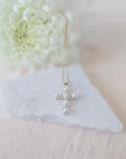 Pearl and cubic zirconia cross necklace