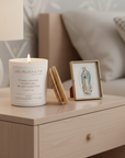 Catholic Prayer Candle with the Surrender Novena prayer text on a wooden nightstand