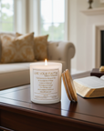 Candle with the serenity prayer on a table in a living room setting