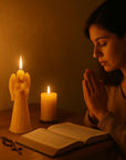 woman praying with guardian angel beeswax candle.