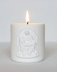 Decorative candle with Pieta image on a white background
