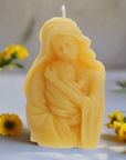 Virgin Mary and child candle with yellow flowers