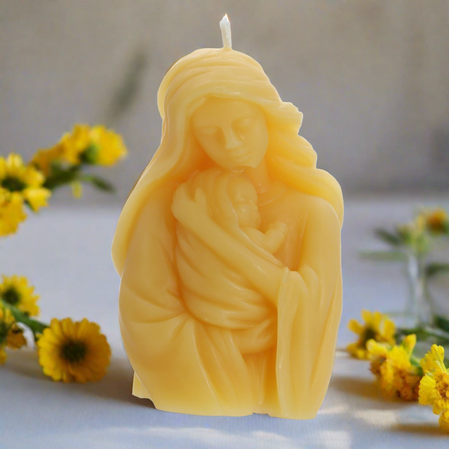 Virgin Mary and child candle with yellow flowers