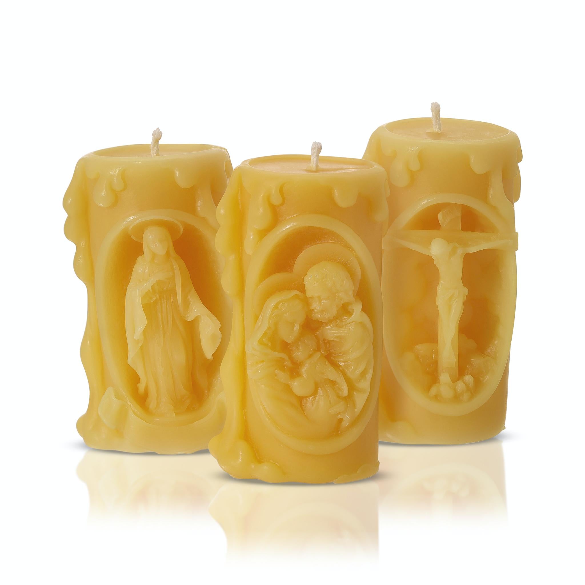 "Hand-poured pure beeswax Catholic candles featuring Virgin Mary, Holy Family, and Crucifix"