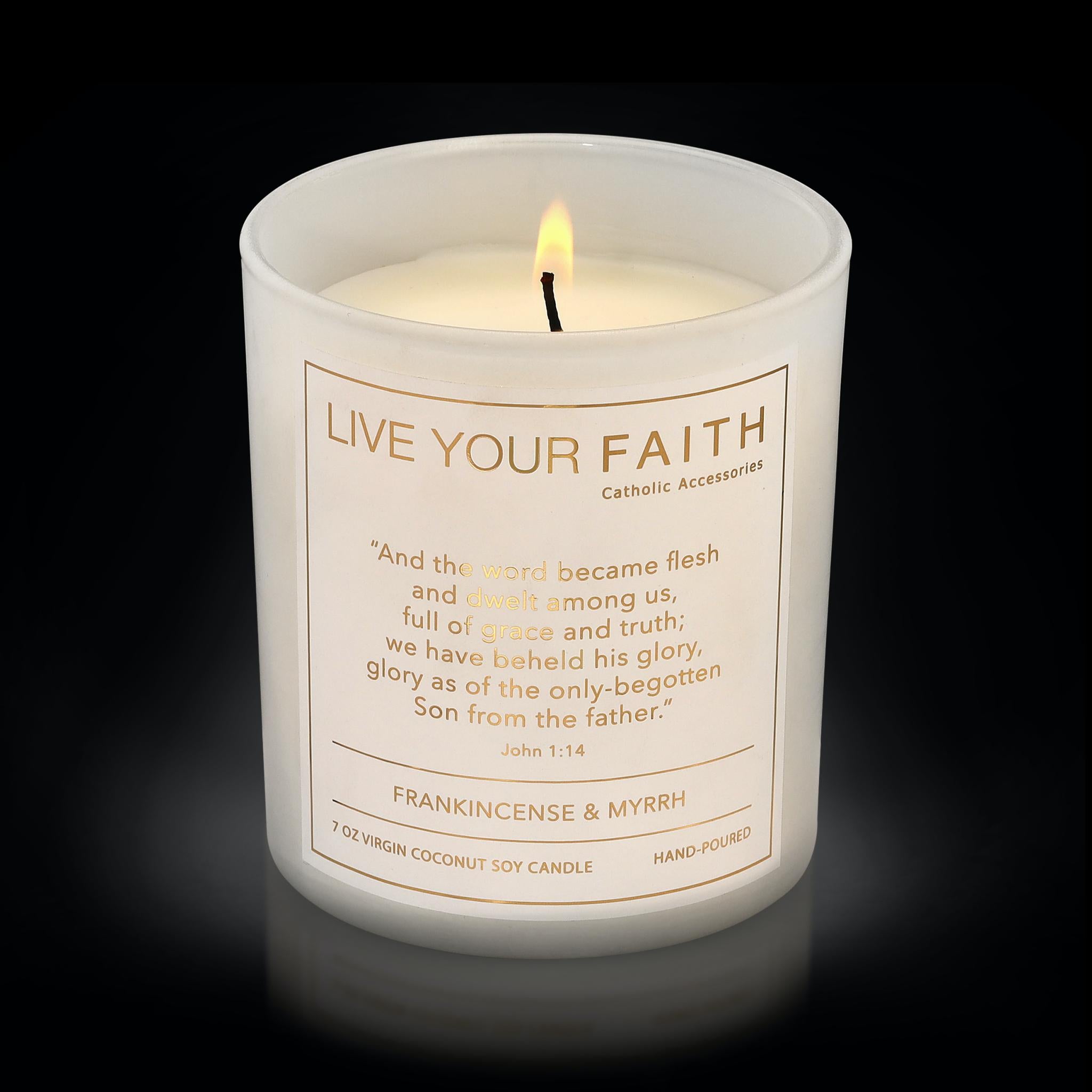 Candle with Bible verse John 1:14  blurred background