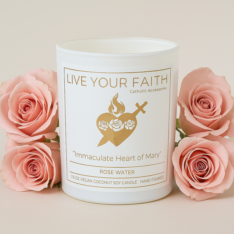 Candle with 'Live Your Faith' label surrounded by pink roses on a light background Immaculate Heart of Mary candle