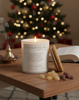 Candle with 'Live Your Faith' text and wooden lid on a white background