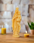 100% pure beeswax candle with an image of our lady help of Christians with baby Jesus.