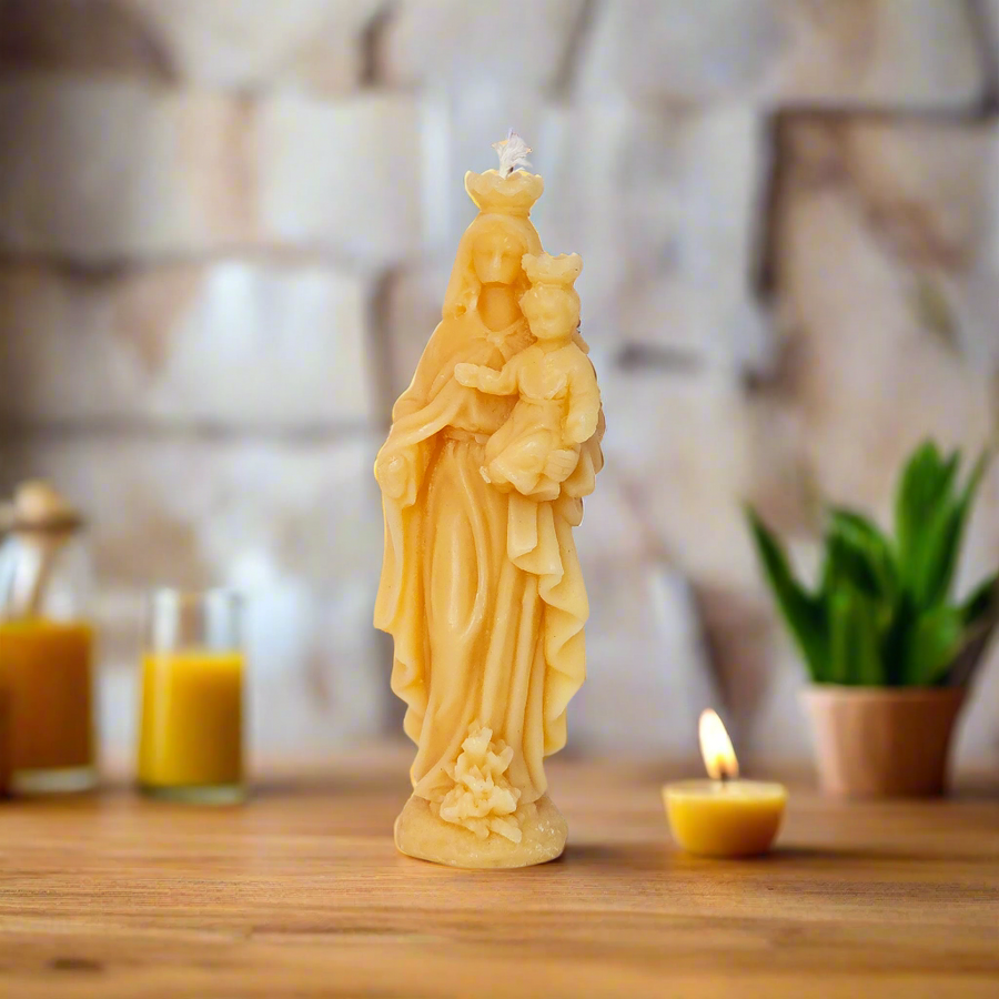 100% pure beeswax candle with an image of our lady help of Christians with baby Jesus.