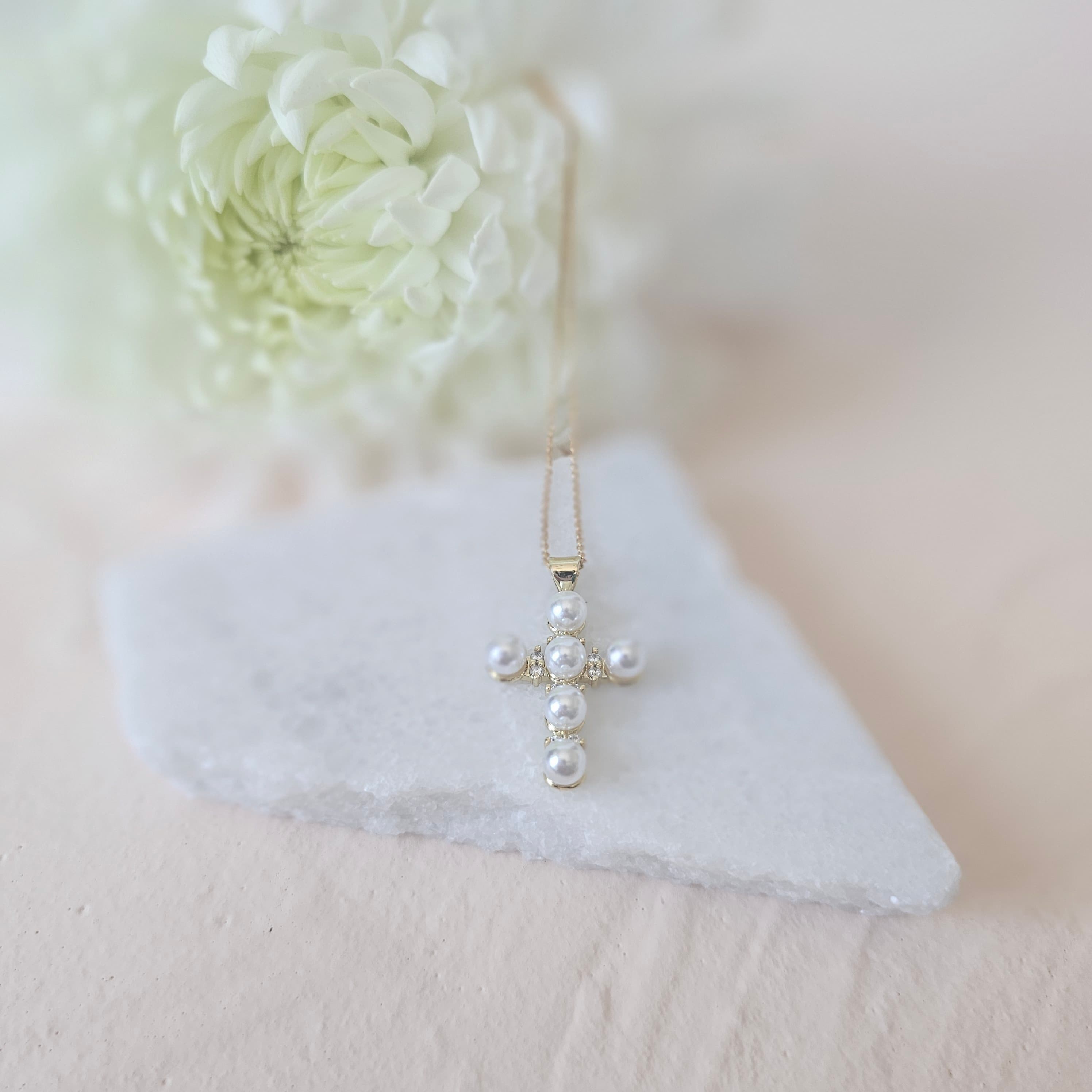 Pearl and cubic zirconia cross necklace
