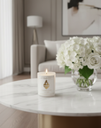 Candle with 'Live Your Faith' and 'Sacred Heart of Jesus' text on a living room.