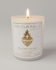 Candle with 'Live Your Faith' and 'Sacred Heart of Jesus' text on a white background