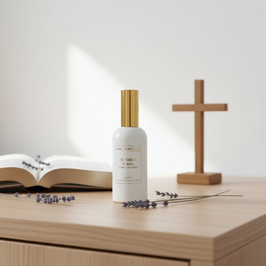 White spray bottle with gold cap on a white background