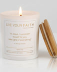 Candle with wooden lid and the surrender novena prayer text on a white background