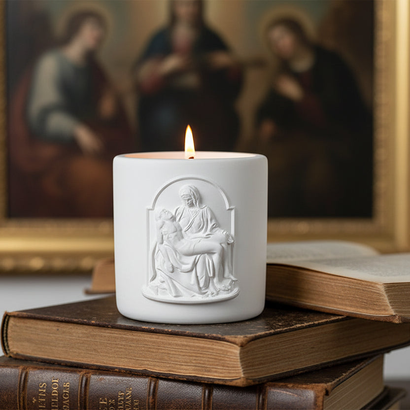 Candle with the image of Pieta on top of a book