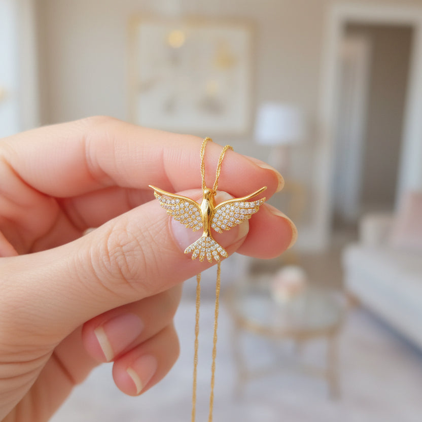 dove necklace on model hand with elegant background